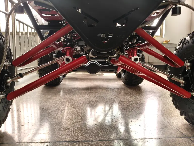 Off-road electric go-kart side view with off-road tires and suspension system